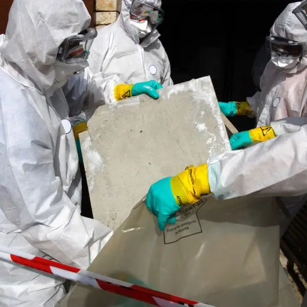 Shot of a Group of Healthcare Workers Wearing Hazmat Suits Working Together During an Outbreak in the City